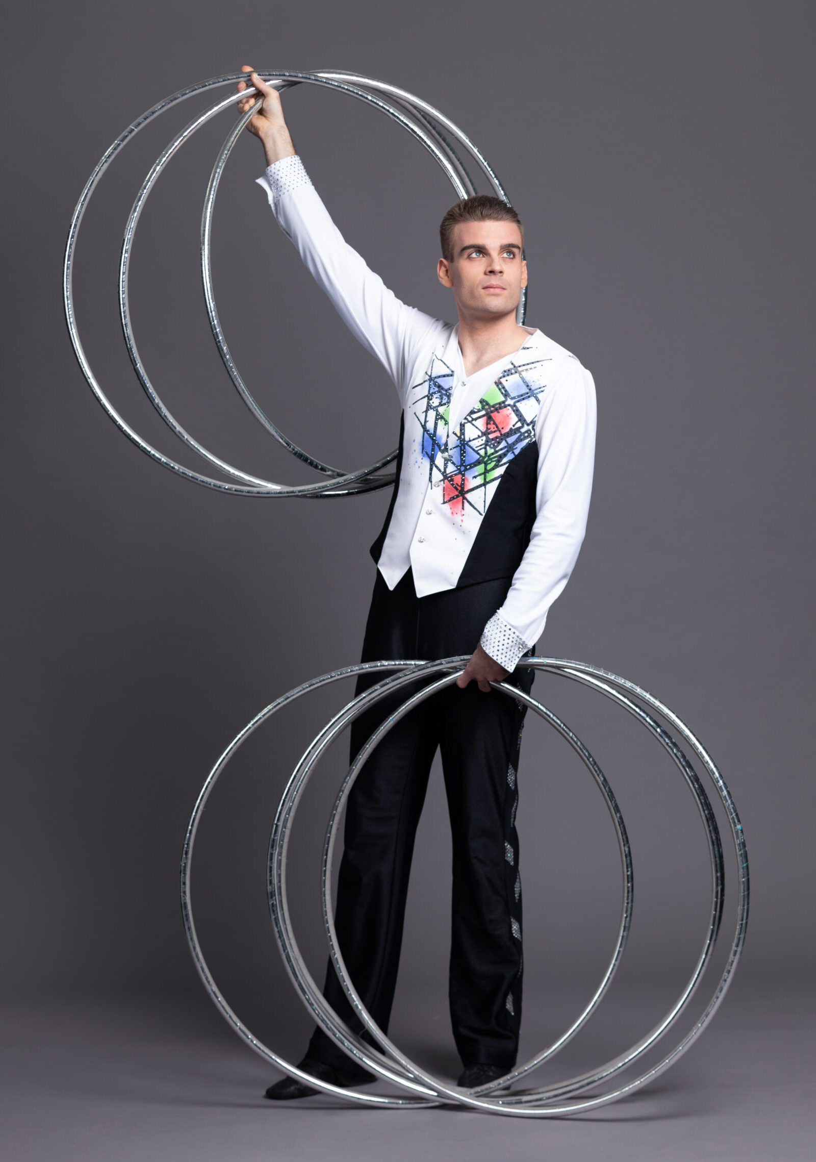 His domain is hula hoop artistry. And he masters it with great virtuosity. 